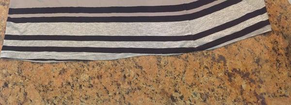 This is a $30 hemming job for a straight cut dress. Owner said that he is an expert in alterations and this is the way it's supposed to be.