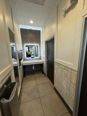 Hand washing station outside bathrooms