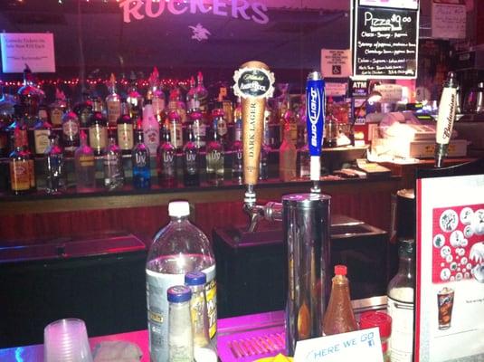 Bar bottles... What do you think is in the bottle with the paper bag around it (between the tappers)?