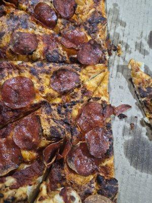 There's no cheese on this double cheese pizza and it is burnt.