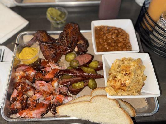 Smoked Beef Jalapeno Sausage, Rib Tips, Smoked Chicken Wings, Macaroni & Cheese, and Beef Baked Beans
