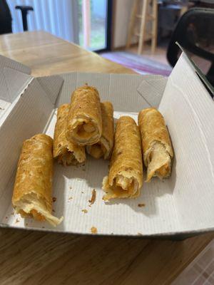 The Nasty orange taquitos, minus the one that was spit into the trash.