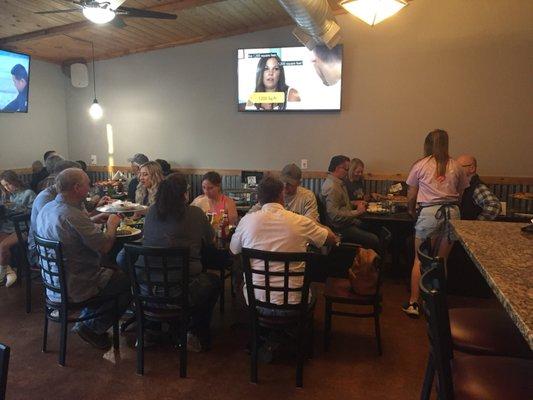 Local patrons enjoying fabulous pizza.