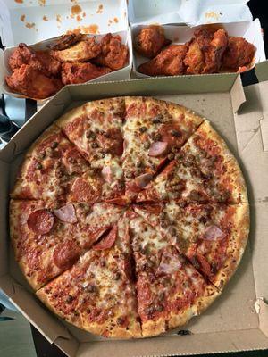 Baked pizza and wings