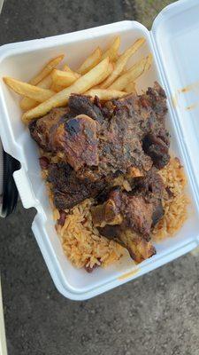 Medium lamb plate with fries and rice and beans