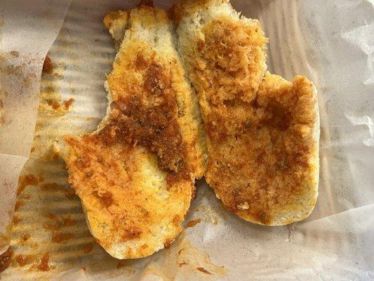 This is the amount of bread left over with no meat. They tried to mask the two little specs of meat with sauce.