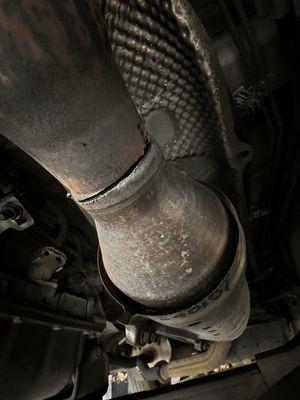 Failed theft attempt of my catalytic converter showing the damage caused.