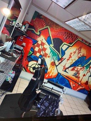 Barber chair and mural