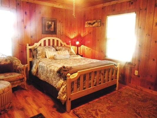 Pinecone's queen size bed and view out window.