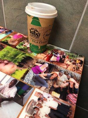 Ugandan coffee on a hand decorated table with pictures of students traveling to Uganda to help with the sustainability projects!