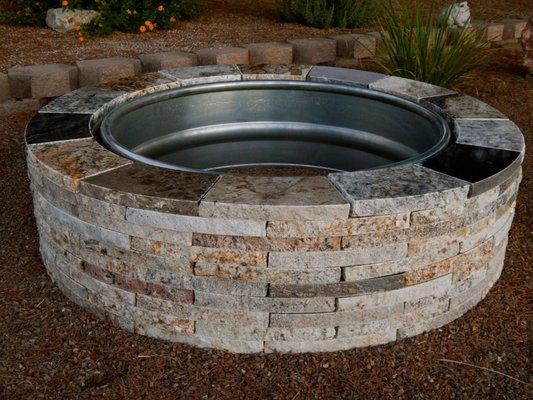 48" diameter x 12" high granite fire pit with steel ring