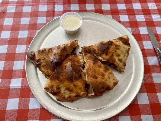 Calzone. Crispy and perfectly balanced flavor. The range dressing was right on.