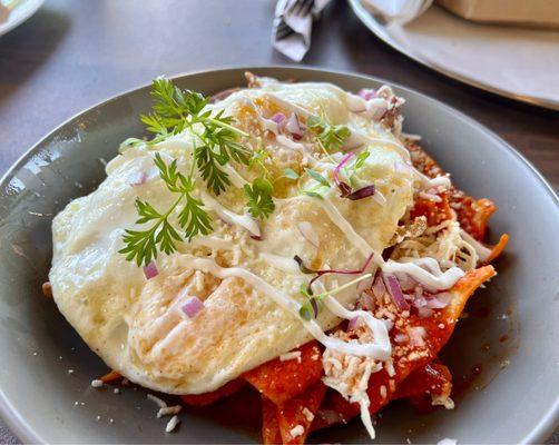 Chilaquiles Texanos with chicken and eggs added for an upcharge. Big on portion and flavor!