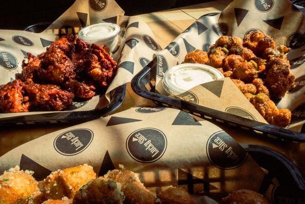 House-made wing sauces take our wings, cauli buds, and dough puppies to the next level.