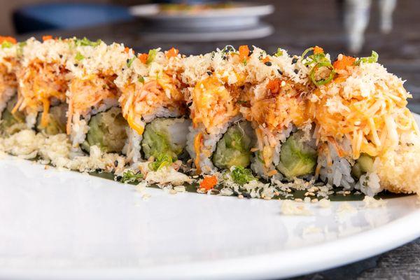 Spicy Snow Crab Roll - Shrimp tempura, cucumber, avocado topped with spicy snow crab and tempura bread.