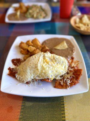 Chilaquiles Rojos with over easy eggs