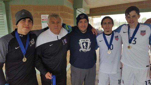 The coaches, captain and goalkeeper of the 2017 Nike Classic Cup Spring U19 Champions: Aurora USA Soccer Academy.