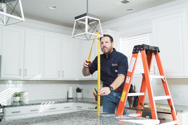 Pendent lights above an island.