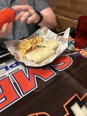 Chicken and bacon wrap with waffle fries