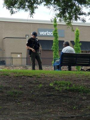 Female cop harrasses disabled man waiting on Marta.