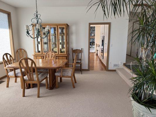 Newly painted and carpeted dining room.
