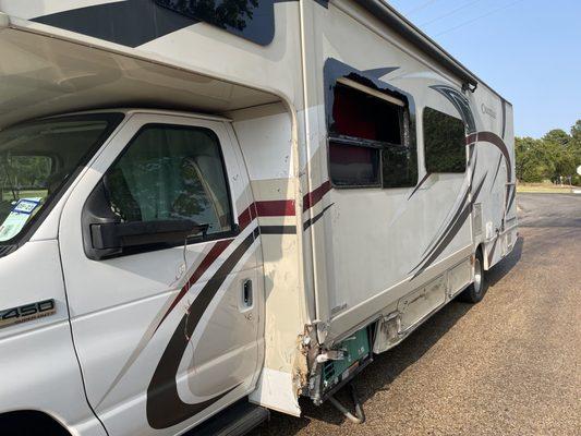 Collision damage to driver side door, frame, slide, windows, storage compartments