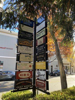 Downtown signs of shops and restaurants.