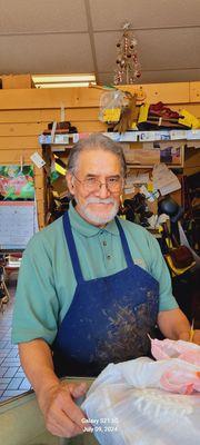 This is Luis, the owner of El Con Cobbler Shop.