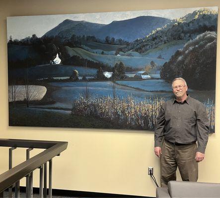 Gary Freeman with his large painting in the Gardner-Webb University library.
