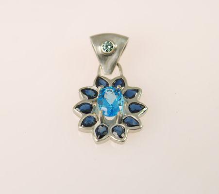 14kt white gold with blue sapphire, blue topaz, green diamond.
