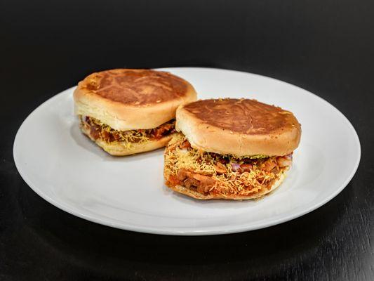 Dabeli. Indian Burger with sweet and tangy mesh potatoes, spiced and roasted peanuts, and yellow nylon chaat sev.