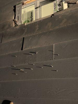 Nails drilled from inside thru the siding of house