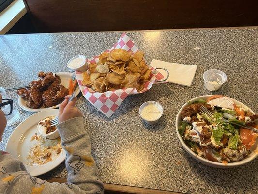 Buffalo wings, home made chips and a buffalo chicken salad