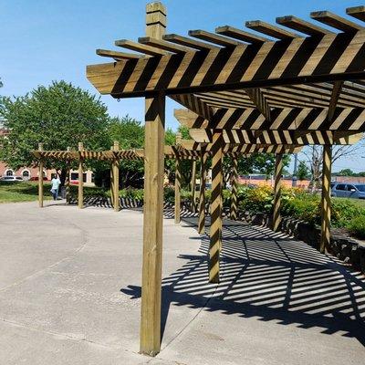 pergola shaded seating along the north end of the park