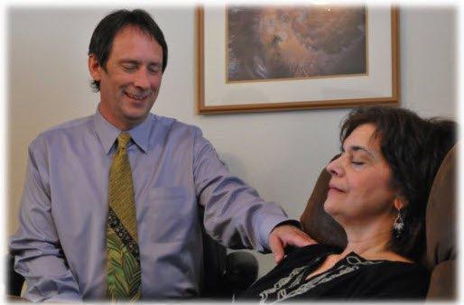 Patrick working with a Client in his office