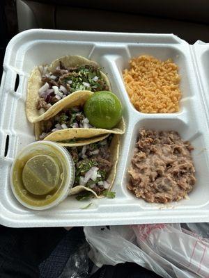3 steak taco plate with rice, beans, and salsa verde on the side.  I cannot stress enough how good everything is!