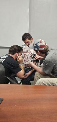 Students taking vital signs with instructors