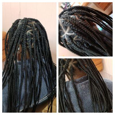 Box braids with triangle part, showing a star to the side.