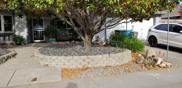 7 yards of slate chips were placed around the house. Brown pieces in the back. 660 sq ft of grass was removed to minimize 'green scape.