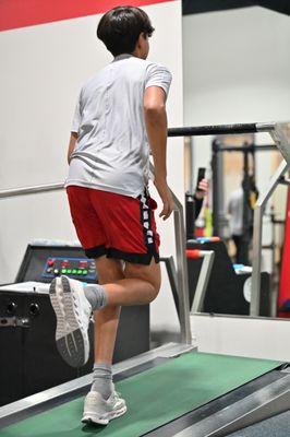 Son on the highspeed treadmill with coach Kasa