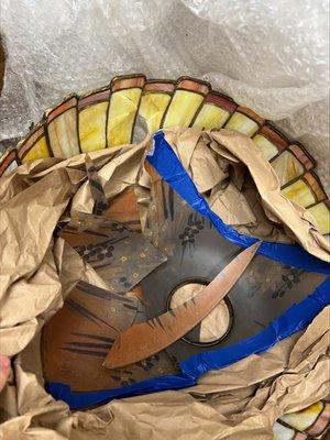 Packing with fragile glass shades on outside packing. Shades destroyed in shipping, of course.