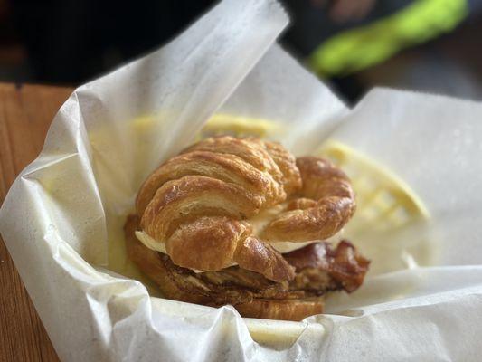 "Figgy Piggy", a fried egg sandwich on a croissant with bacon and fig jam.