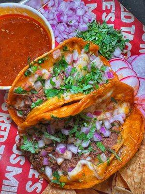Our famous combo #1:
2 Birria tacos w/ cheese, side of chips, & side of consome to dip or sip