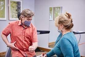 Physical therapist Shawn Tucker with a client.