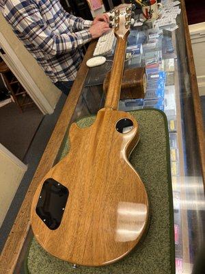 Brian - Head of Repairs - carefully inspecting my guitar.