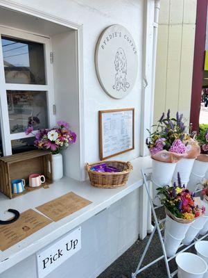 Fresh flowers near the ordering window