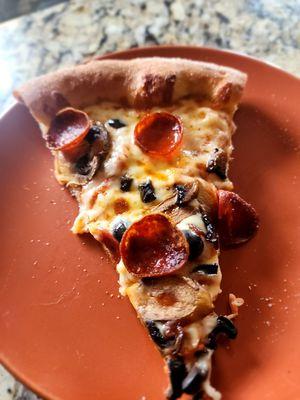 A nice slice: pep mush y olives