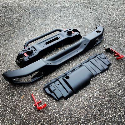Jeep Rubicon powder coating bumpers, skid plate and tow hooks.