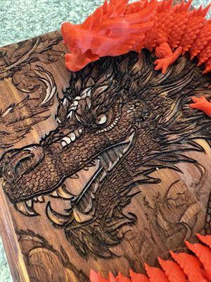 Deep 3D engrave on cherry wood and a matching 3D printed dragon.