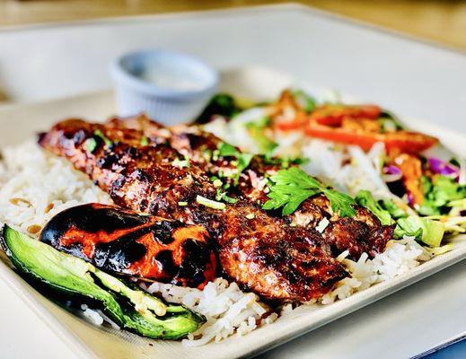 "Ground Lamb Kabob" dinner platter comes with 2 kabobs in house made rice & salad Excellent. OuiOui.